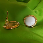 Large MONET Milk Glass Gold Tone Button Clip On Earrings